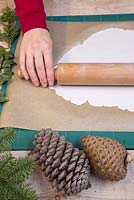 Use a rolling pin to flatten out the modelling clay