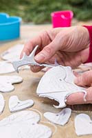 Gently remove the excess clay from around the cut out hearts