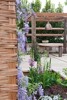 Recycled timber pergola and sandstone outdoor dining table