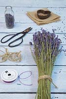 Materials required are sprigs of Lavender, needle, purple string, hessian, heart shaped object, scissors and pencil