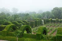 View of the hornbeam 'cloister' at Le  Prieuré Notre Dame d'Orsan in the mist