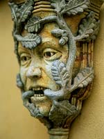 Close up of druid mask entwined in oak leaves. Zieglers architectural antique and garden statuary. Owner: Nina Ziegler.