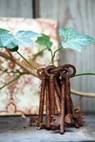 Hedera helix with rusty keys on shelf in Lucille Lewins, small office court yard garden in Chiltern street studios, London. Designed by Adam Woolcott and Jonathan Smith