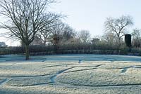 Frosty lawn with mown stripe pattern, RHS Garden Wisley, Surrey 