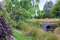 Stone bridge at Bhudevi Estate garden, Marlborough, New Zealand.