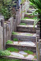 Steps constructed from sleepers and reclaimed wood imported from India at Bhudevi Estate garden, Marlborough, New Zealand.