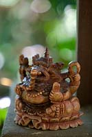 Close up of a Balinese carved timber decoration of the Elephant headed God, Ganesha.