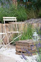 Bistro chair with wooden crate for a table, surrounded by Lavender - The Lavender Garden, RHS Hampton Court Palace Flower Show 2016