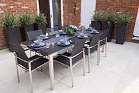 Enclosed patio dining area with table prepared