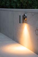 Downlight lighting feature built into sandstone patio wall