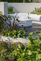 Curved seating area with white Halo seats and planters and mixed planting - Hidden Gems of Worcestershire, RHS Malvern Spring Festival 2016. Design: Nikki Hollier. Silver, Best Festival Garden