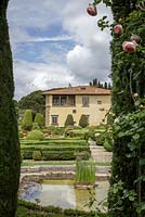 Villa Gamberaia, Settignano, Florence, Tuscany, Italy. Formal Italianate garden with a view across the pond to the house