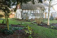 Old Church Cottage, a 400 yr old building the garden of which adjoins a disused churchyard complete with ancient yews and Norman tower.