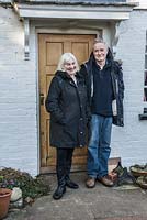 Dr John and Margaret Noakes outside their home, Old Church Cottage.