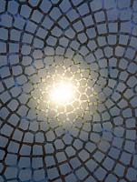 Detail of illuminated glass panels emulating the mathematically perfect Fibonacci spiral inset into the wooden floor of the belvedere in the Winton Beauty of Mathematics, RHS Chelsea Flower Show 2016.