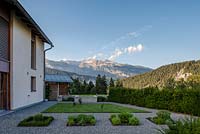 Herbs in squares, fir hedge with a view to the Swiss mountains
