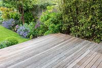 An empty wooden deck measuring 3m x 4m, before planted pots are added.
