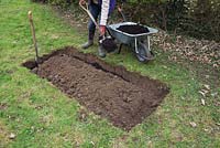 Once excavated to 12 inches deep, fill the interior edges with compost