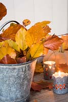 Autumn leaves - Copper Beech in metal bucket with tealights