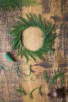 A wreath constructed from green Fern fronds