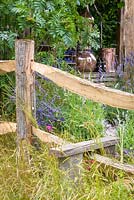 Stile and rustic wooden fencing. Hampton Court Flower Show 2016. 