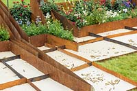 Corten Steel Raised Beds in Peacemaker - Dying Hope Garden, RHS Hampton Court Palace Flower Show 2016.Designer: Kartina Rafaj