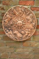 Wall mounted terracotta 'signs of the zodiac' plaque at Bolham Manor, Nottinghamshire