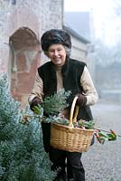 Lady Michaela Reid collecting cotoneaster and rosemary