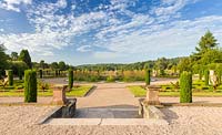 A view over the formal Upper Flower Garden, down over the Italian Garden at Trentham Gardens, Staffordshire - designed by Tom Stuart-Smith. Planting in the Upper Flower Garden includes Pelargoniums, Begonias, Stipa gigantea and fastigate Irish yews