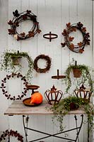 Autumnal display with wreaths on wall. Rosendals Tratgard. Stockholm. Sweden