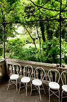 Row of chairs. Villa Singer Garden. Milan. Italy

