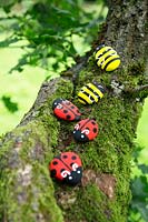 Garden craft making painted Bumble bees and Ladybirds with stones.  