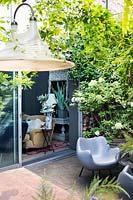 Outside lounge area with large light hanging. Hackney, London