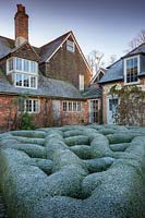 Box knot garden in winter in the Courtyard Garden, Bury Court Gardens, Hamshire, UK. Designed by Piet Oudolf and John Coke.