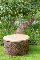 A willow chair  sculpture by Tom Hare -  It's All About Community Garden - RHS Hampton Court Palace Flower Show 2017 -Designers: Andrew Fisher Tomlin and Dan Bowyer.