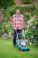 Mowing a lawn with an electric lawnmower
