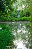 Pond with modern sculptures - Asthall Manor, Oxfordshire
