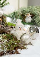 Christmas arrangement with snowman an Christmas ornaments
