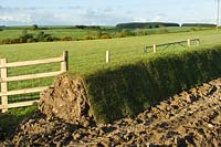 Turf wall being built alongside fields