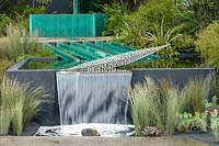 Chelsea Flower Show 2006, London, UK. 'The 100% Pure New Zealand Garden' ( des. Xanthe White ) modern pool with waterfall