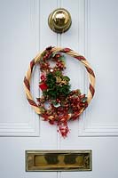 Christmas wreath on front door of house