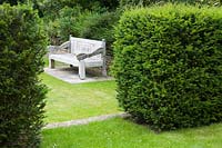 Hillesley House, Gloucestershire, UK ( Walsh ) wooden bench, Yew hedging