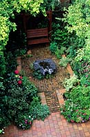 private garden Manchester design Alan Titchmarsh overview of small suburban town patio garden with brick and tile paving covered