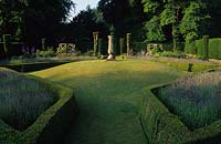 Cranbourne Manor Dorset the sundial garden mound lawn with boxwood hedges and lavender focal point
