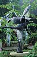 RHS Wisley Surrey spiders' webs on Eros sculpture in patio garden design by Julie Toll.