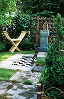 small decorative garden design Steven George Hall modern wooden seat secluded private area