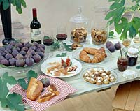 Table setting with sweet figs dishes 