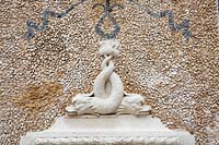 Fountain of The Regaleira. Detail of mosaic and stone  Dolphin fountain. Sintra, Portugal.
