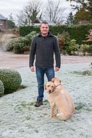 Gardener Kevin Toms with labradors, Sedgwick Park, West Sussex