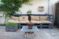 A decked seating area made with recycled materials